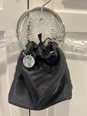 Lulu Black Drawstring Satin Wristlet with Silver Logo Disc